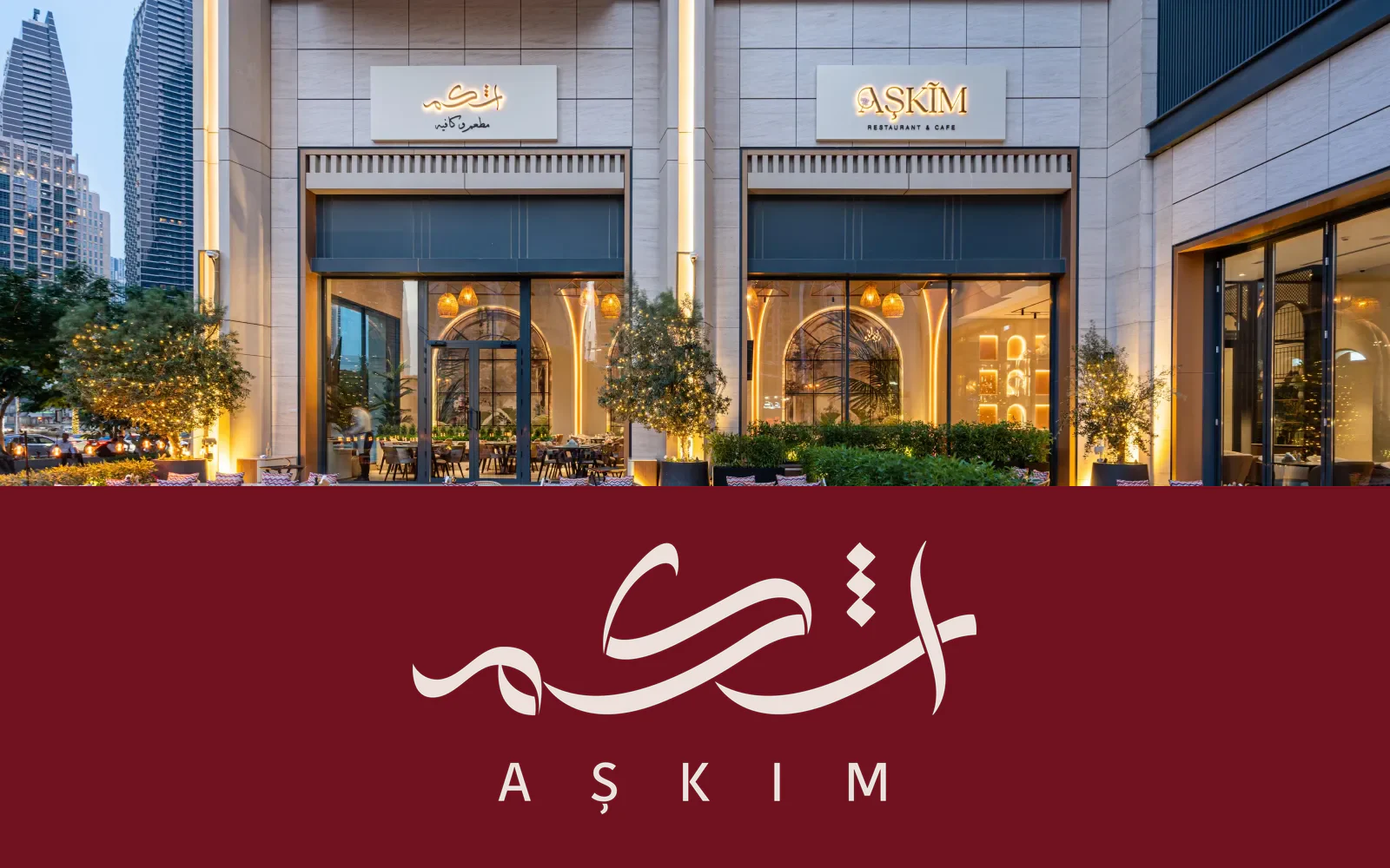 AŞKIM restaurant facade above its cream Arabic and Latin logo on a burgundy background.