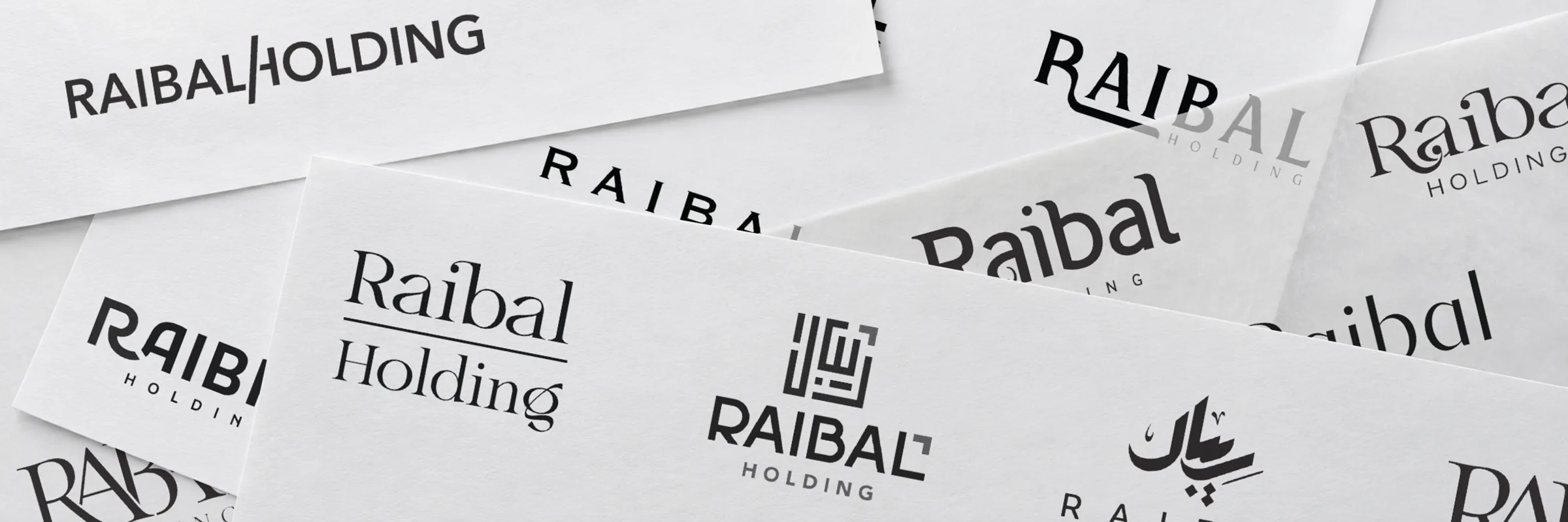 Overlapping sheets of Raibal logo explorations showing Arabic and English lettering and symbol directions.